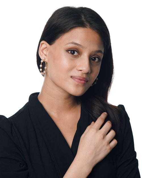 Gold-tone hoop earrings with draped pearls