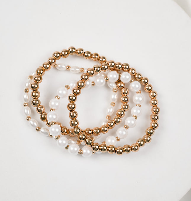 White Pearl and Gold Beaded Layered Bracelet Styled on Wrist - Hashtack