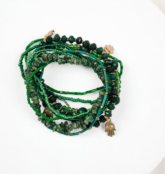 Layered Emerald Green Beaded Charm Bracelet Styled on Wrist - Hashtack