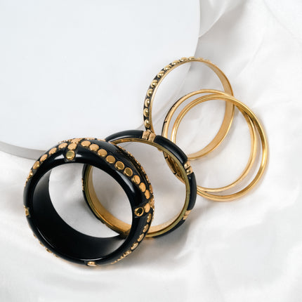 Black and Gold Studded Resin Bangle Stack Styled on Wrist - Hashtack