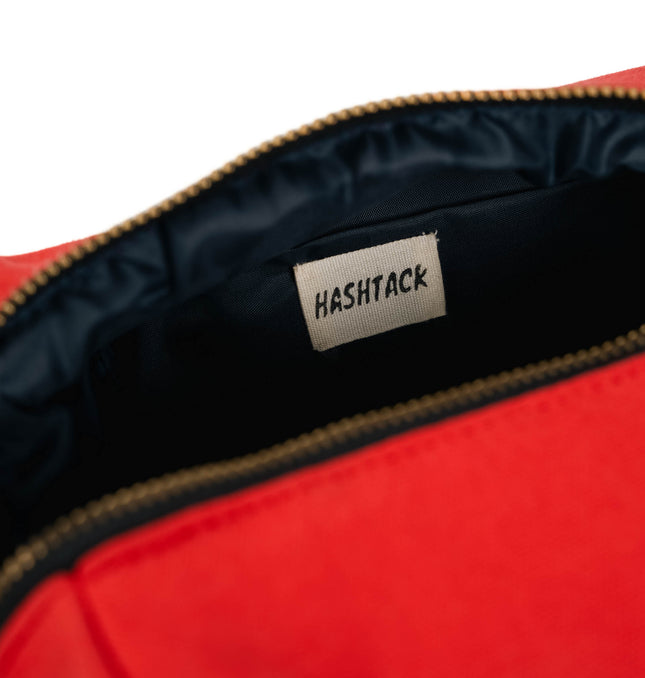 Open Scarlet Muse pouch showing black lining and gold-tone zip