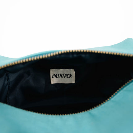 Aqua blue utility pouch for women angled view showing texture