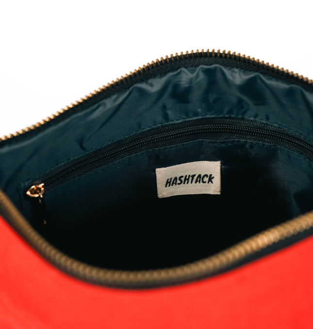 Red wristlet pouch for women showing interior and wrist strap