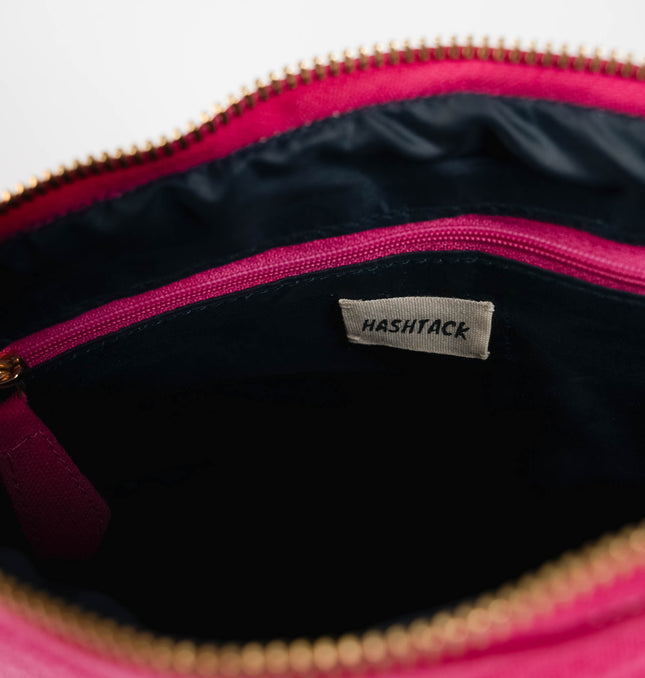 Fuchsia pink wristlet pouch for women showing strap detail