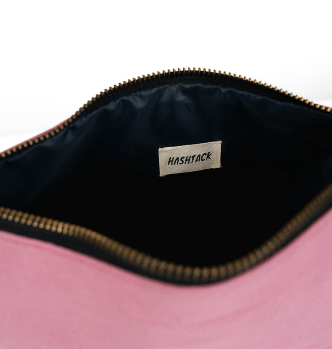 Blush pink wristlet pouch for women showing strap detail