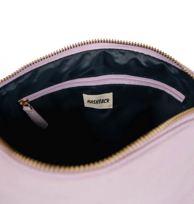 Purple wristlet pouch for women showing strap detail