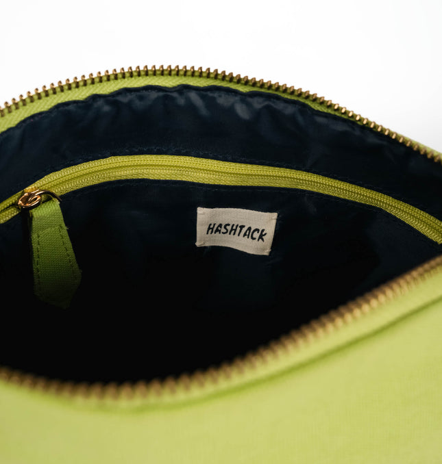 Detailed side profile showcasing metal zipper pull and reinforced seam construction