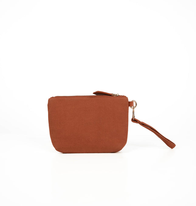 Front view of terracotta brown utility pouch in Terracotta Brown with gold zipper and textured canvas