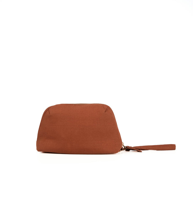 Front view of terracotta canvas utility pouch in Terracotta with gold zipper and textured canvas