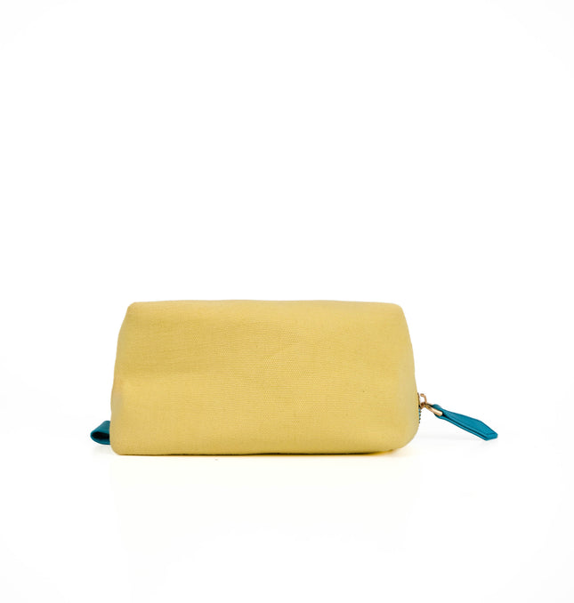 Front view of yellow canvas utility pouch in Yellow with Turquoise Trim with gold zipper and textured canvas