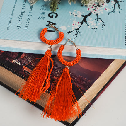 Fiery Orange Tassel Hoop Earrings