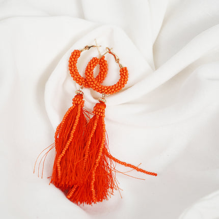 Fiery Orange Tassel Hoop Earrings